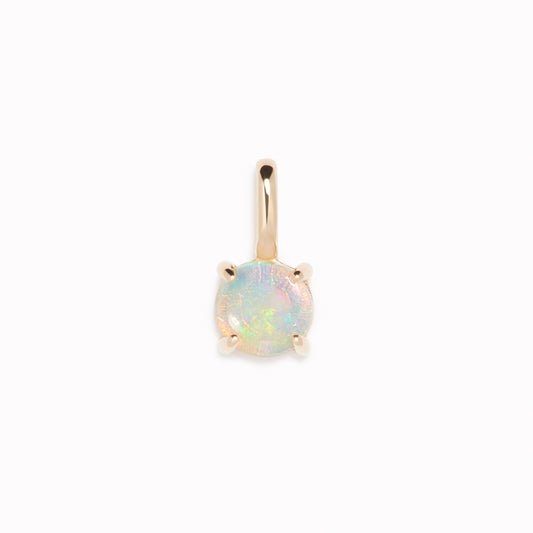 Opal Charm 14k Gold with iridescent opal gemstone set in 14k yellow gold on a white background