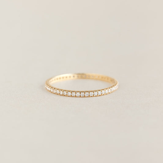Diamond Eternity Ring in 14k yellow gold featuring a continuous row of sparkling lab-grown diamonds on a neutral background