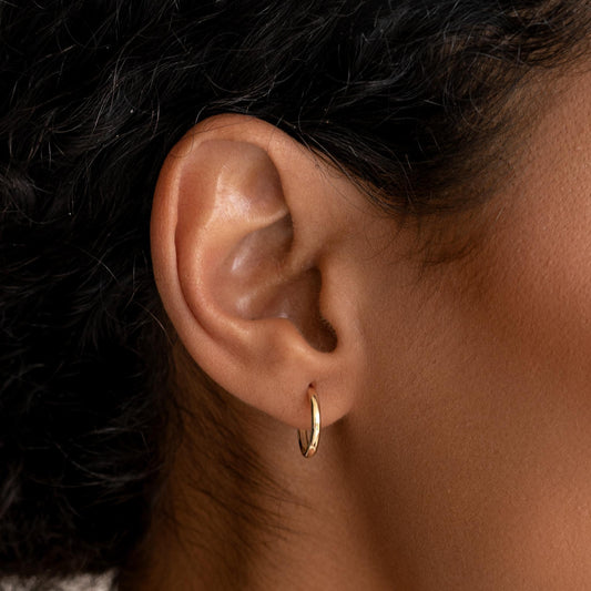 Handcrafted 14k gold huggie earrings