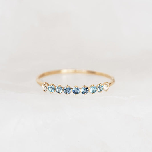September Birthstone Ring 14k Gold - Ombre London Blue Topaz with delicate gemstones set in a thin gold band on white background