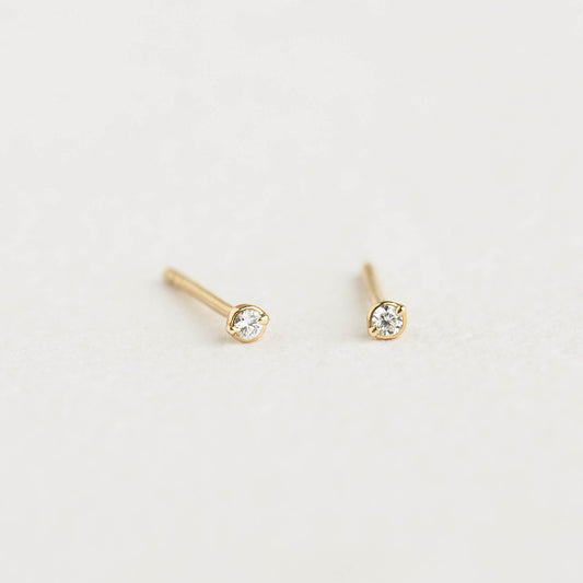 Diamond Stud Earrings 14k Gold - Eloise with round lab grown diamonds set in 14k yellow gold on a neutral surface