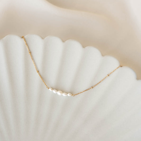 Close-up of Pearl Boat Necklace - Zanna featuring five graduated freshwater pearls on a gold vermeil beaded chain