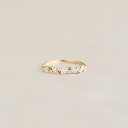 Close-up of Marquise and Round Diamond Ring 14k Gold - Celia with floral diamond details on a neutral background