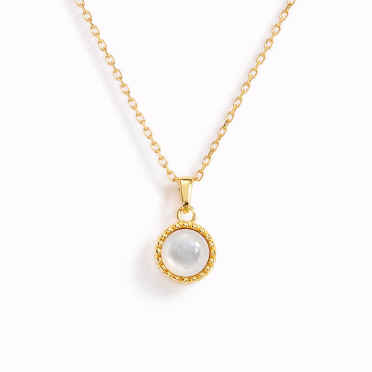 June birthstone necklace with bezel set mother of pearl on a gold chain