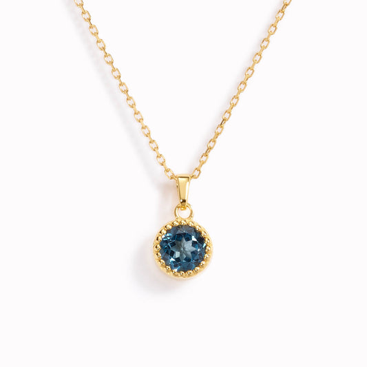 September birthstone necklace with bezel set london blue topaz pendant in gold vermeil