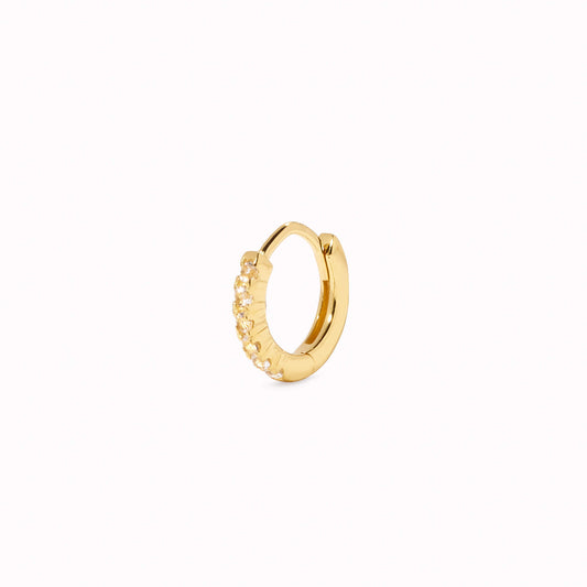 Huggie Hoop Earring - Eva (single) in gold with white topaz gemstones on a white background