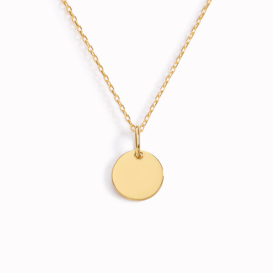 Gold necklace with disc pendant