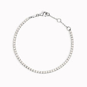 Cubic Zirconia tennis bracelet with white stones in sterling silver on white background