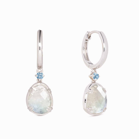 Silver Rainbow Moonstone Earrings - Victoria (Blue Gem) with faceted stones and blue cubic zirconia accents on white background