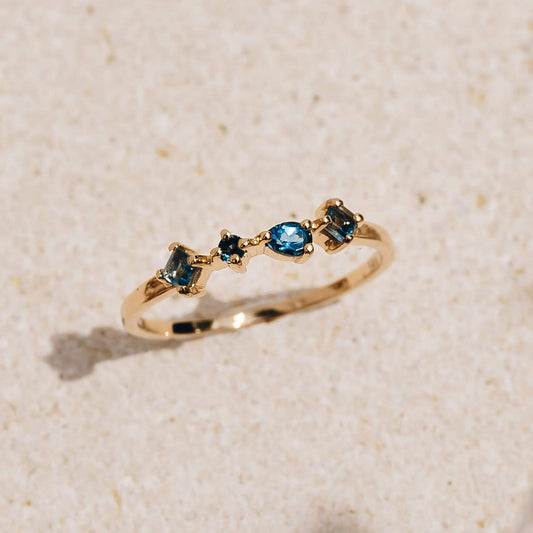 London blue topaz ring in 14k yellow gold with irregular gemstones
