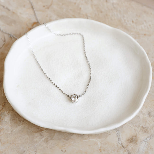 Gemstone necklace with bezel-set white topaz on silver chain