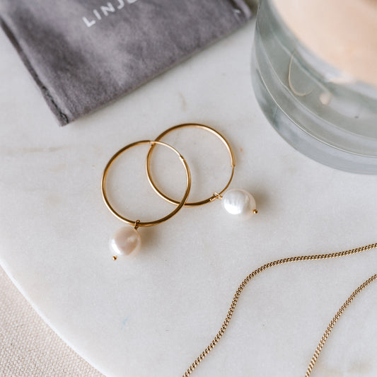 Gold hoop earrings with baroque pearl drops in gold vermeil