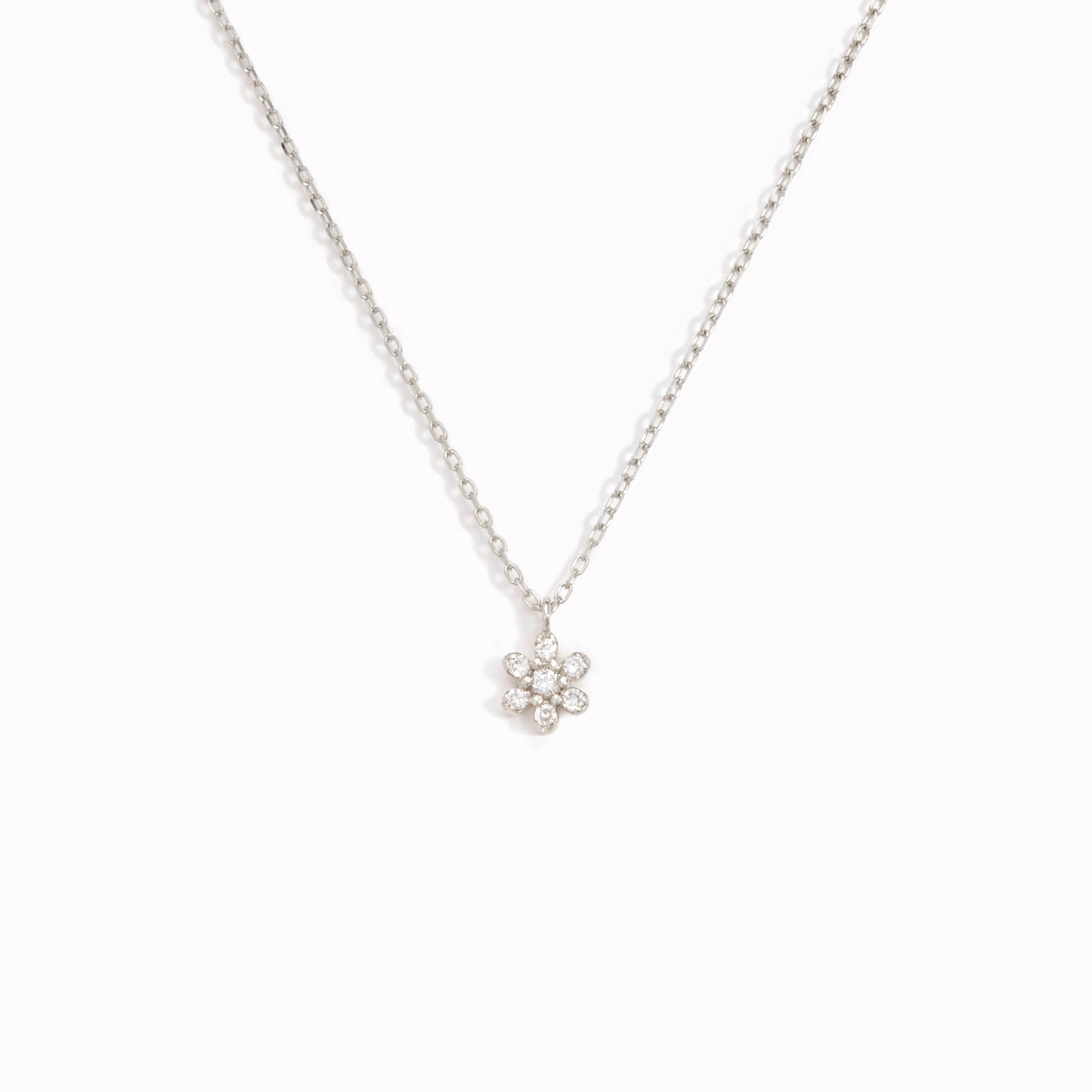 Diamond Flower Necklace White Gold - Haldis featuring seven diamonds in a delicate flower pendant on white gold chain