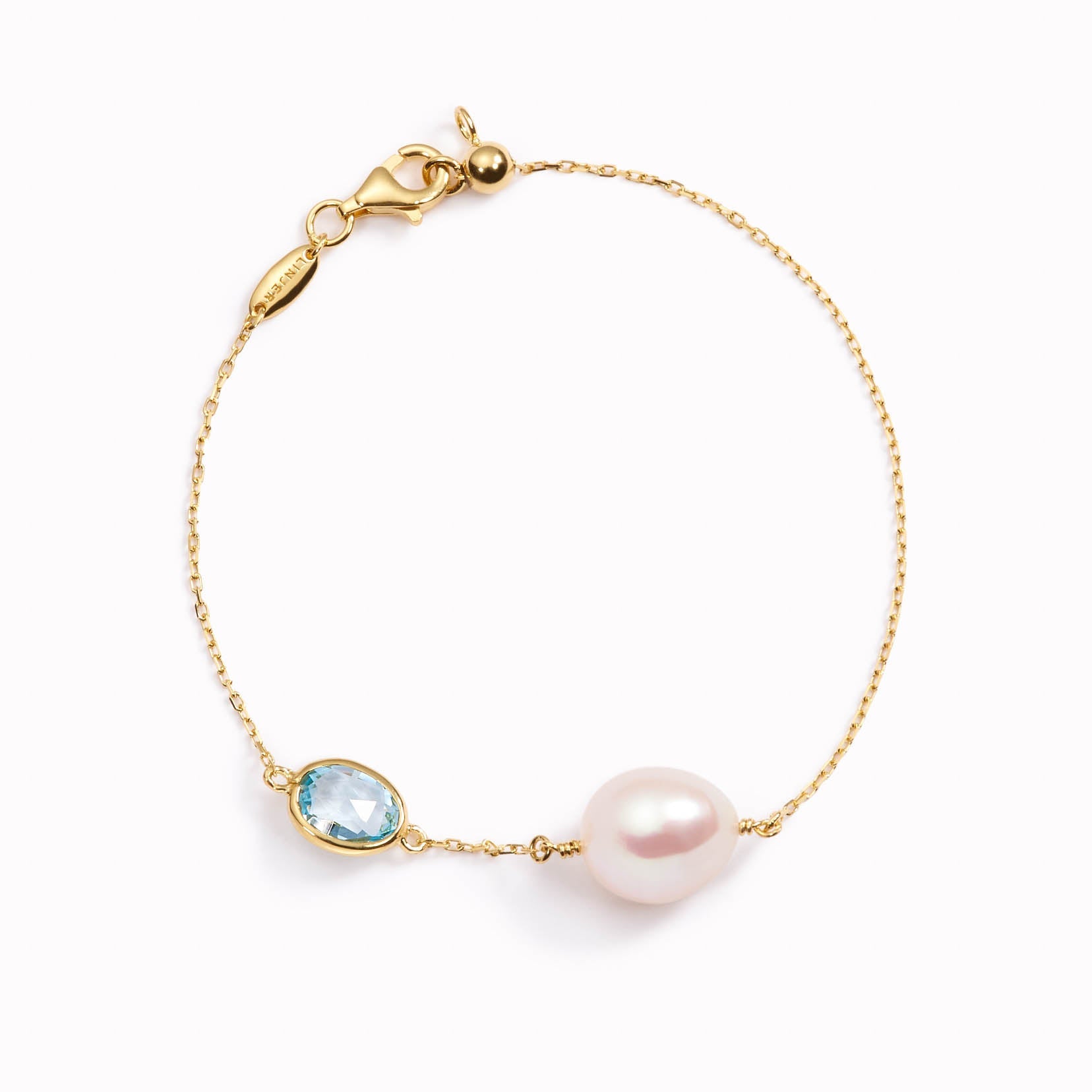 Freshwater baroque pearl bracelet and blue topaz gemstone on gold chain