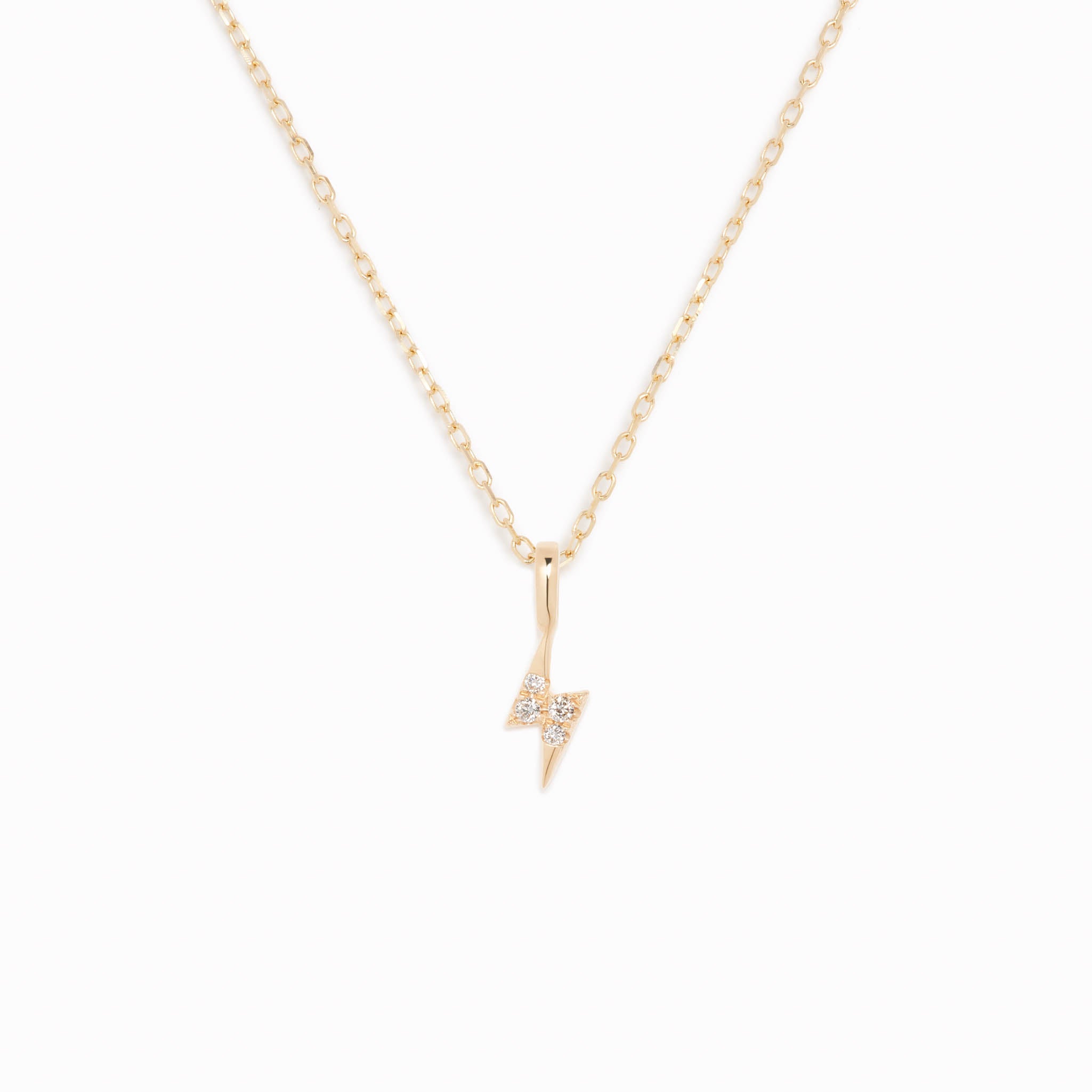 Diamond Lightning Bolt Charm 14k Gold with round diamonds on a delicate yellow gold chain on a white background