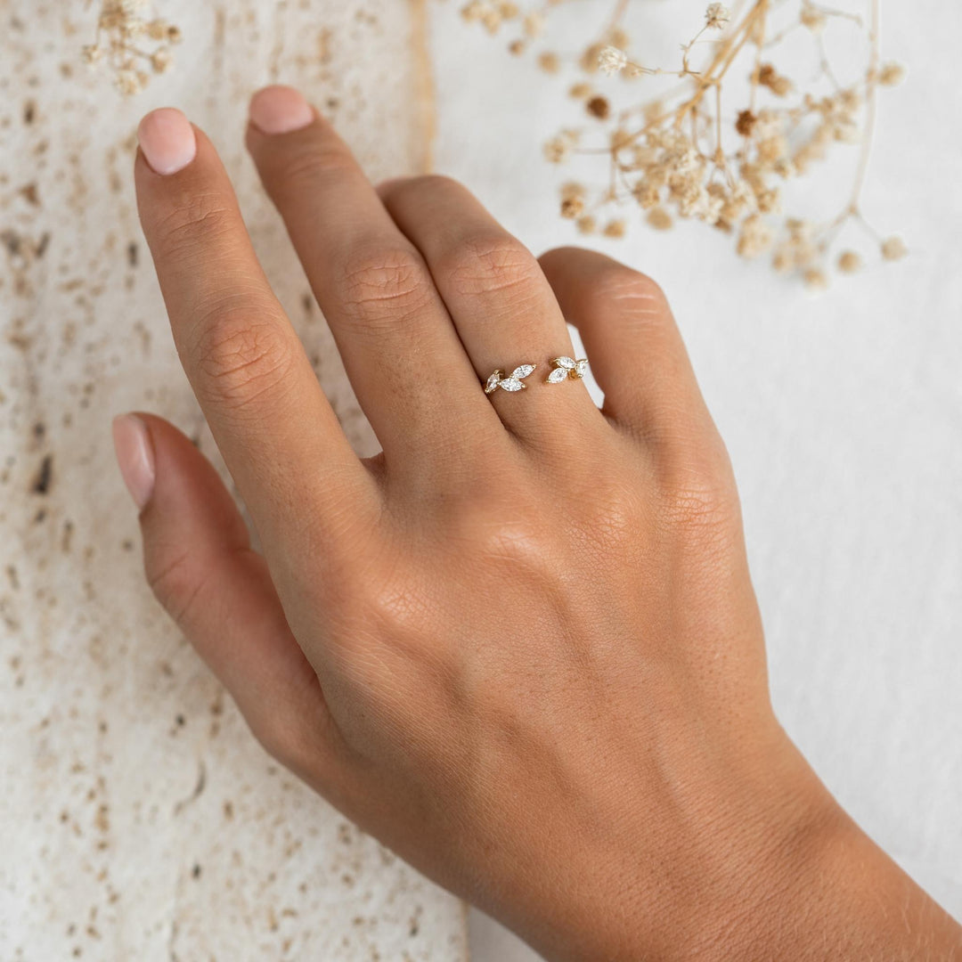 14k gold open leaf ring with lab grown diamonds in laurel leaf design on model