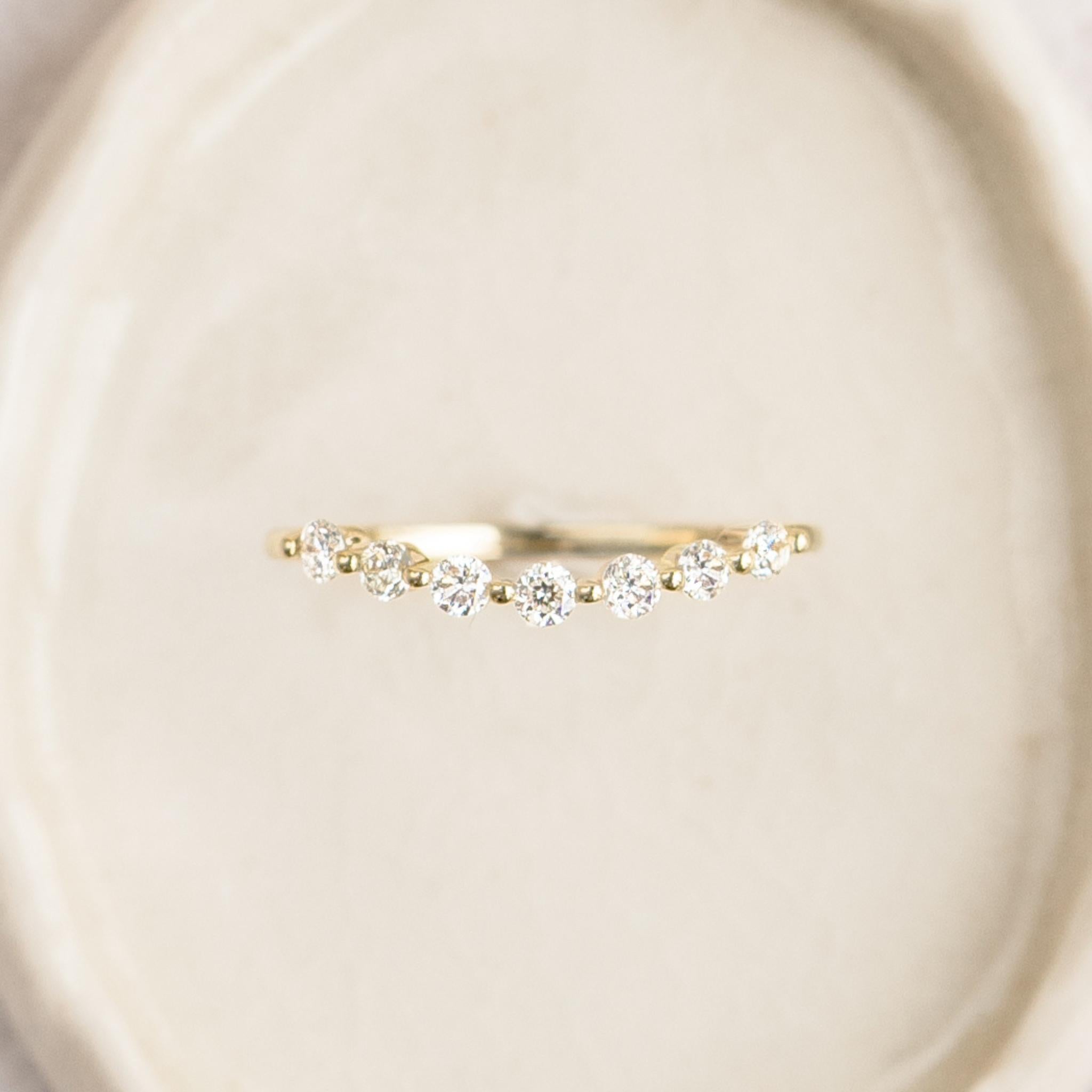 Lab grown diamond ring on curved solid gold band