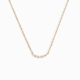 Five lab grown diamonds on a 14k yellow gold necklace chain