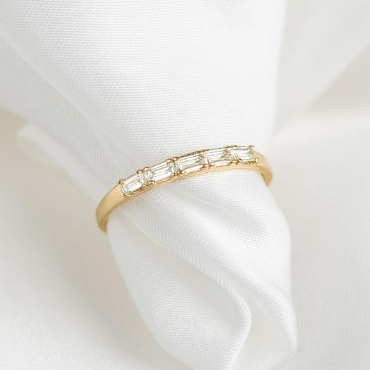 Baguette cut diamonds on half-eternity 14k yellow gold band