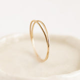 14k Gold Double Ring - Celestina standing on a plate