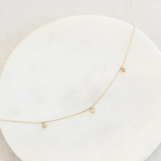 Three bezel set opals on 14k yellow gold chain necklace