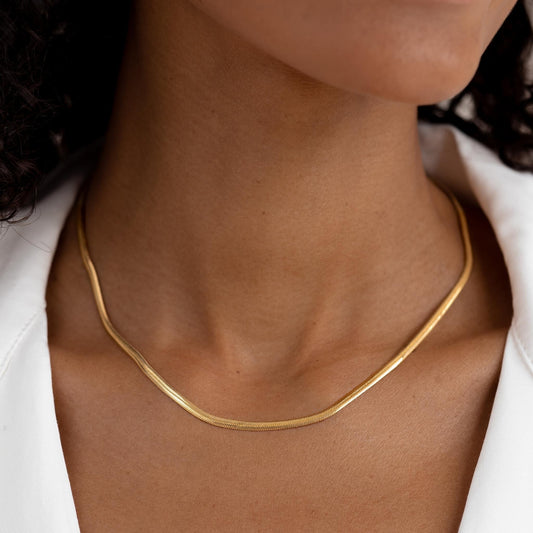 Snake chain necklace in gold vermeil on neck