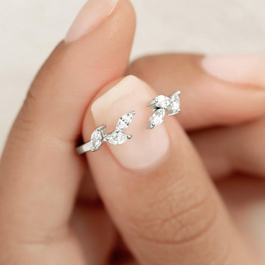 Unique open silver ring adorned with marquise gemstones