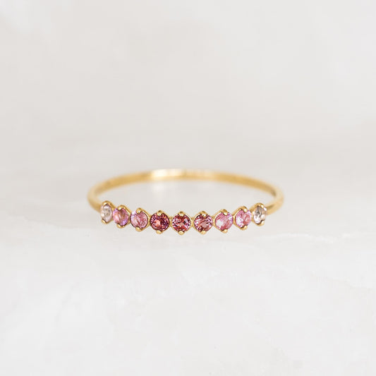 July Birthstone Ring 14k Gold - Ombre Tourmaline featuring a delicate gold band with pink to red ombre gemstones on a white background