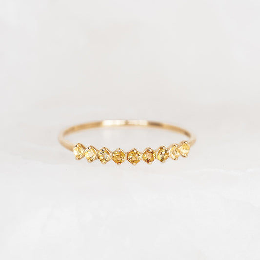 November Birthstone Ring 14k Gold - Ombre Citrine with nine sparkling citrine gemstones on a white marble background