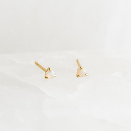 October Birthstone Stud Earrings 14k Gold - Opal with delicate opal gemstones set in 14k yellow gold three-prong settings on white background