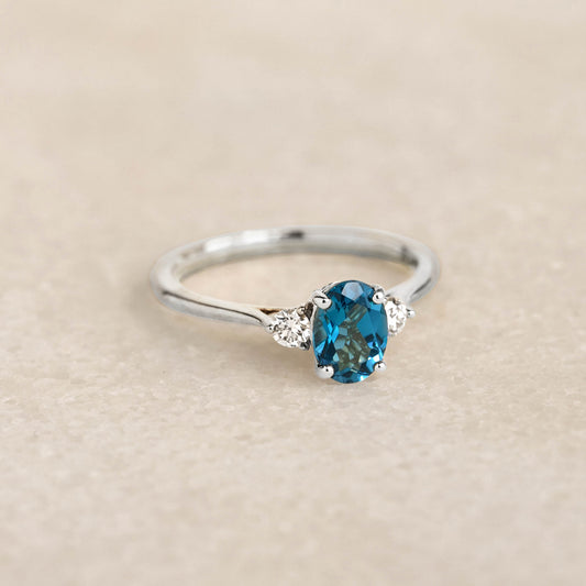 London Blue Topaz and Diamond Ring White Gold - Kindra featuring oval blue topaz with two diamonds on white gold band