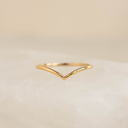 Close-up of V Ring 14k Gold - Malva featuring a delicate chevron design on a soft neutral background