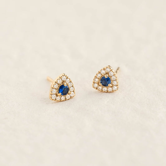 Close-up of Sapphire and Diamond Stud Earrings - Marika featuring round blue sapphires with diamond halo in 14k gold