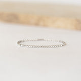 Close-up of Diamond Tennis Bracelet White Gold (1.501 ct tw) - Mirella displayed on a soft light surface