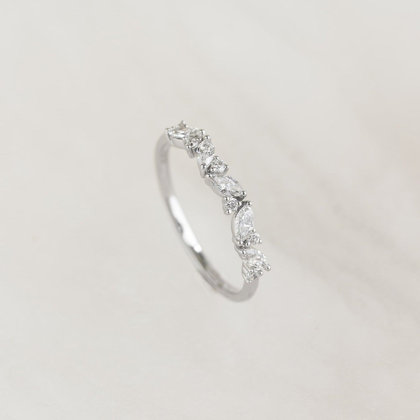 Close-up of Marquise and Round Diamond Ring White Gold - Celia featuring a delicate floral diamond design on a white gold band