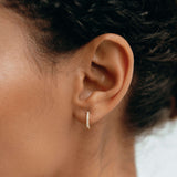 14k gold huggie earrings with 9 lab grown diamonds