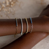 Tennis bracelets with white gemstones and blue gemstones made of gold vermeil and sterling silver 