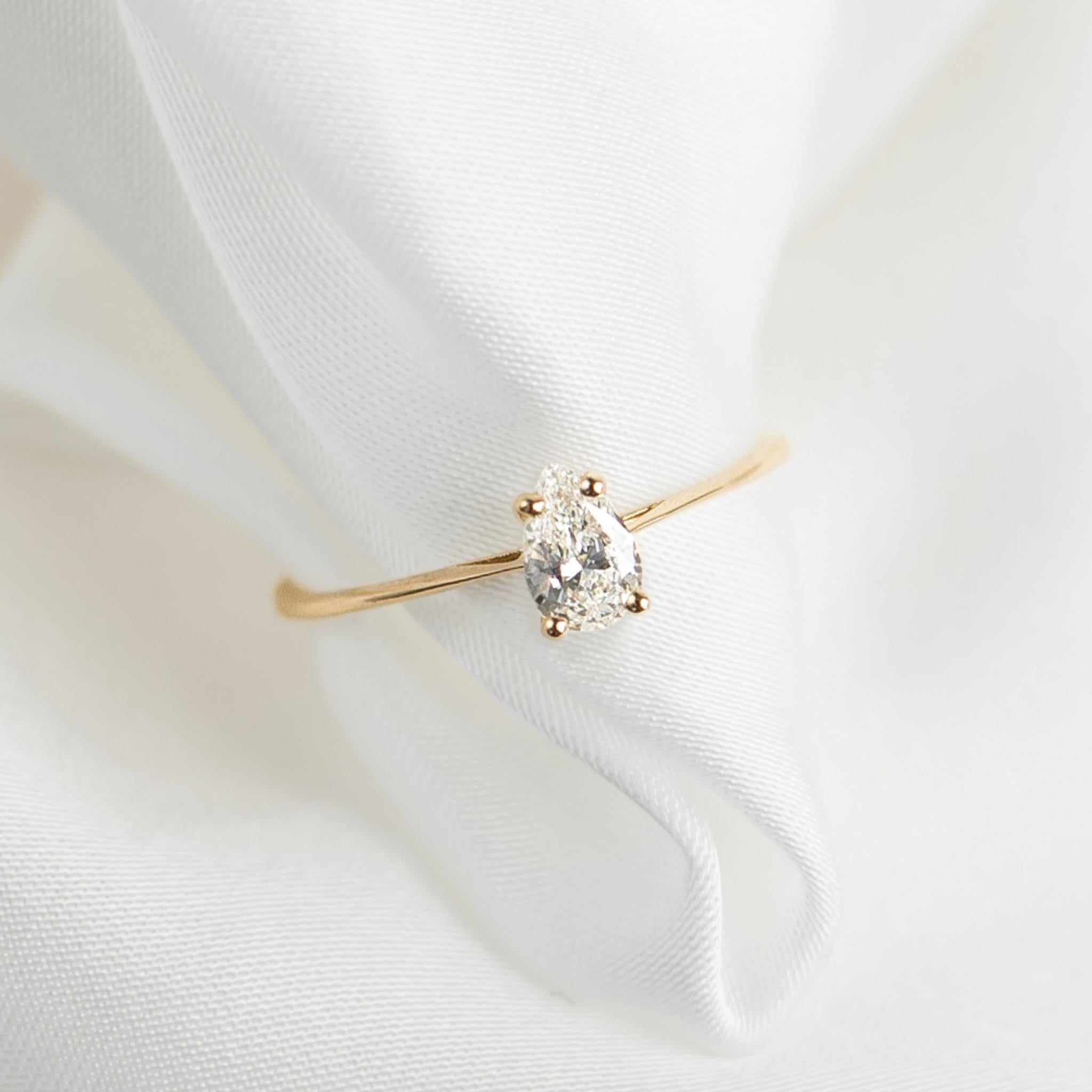 Lab grown diamond ring in 14k yellow gold in pear cut shape with four prong setting