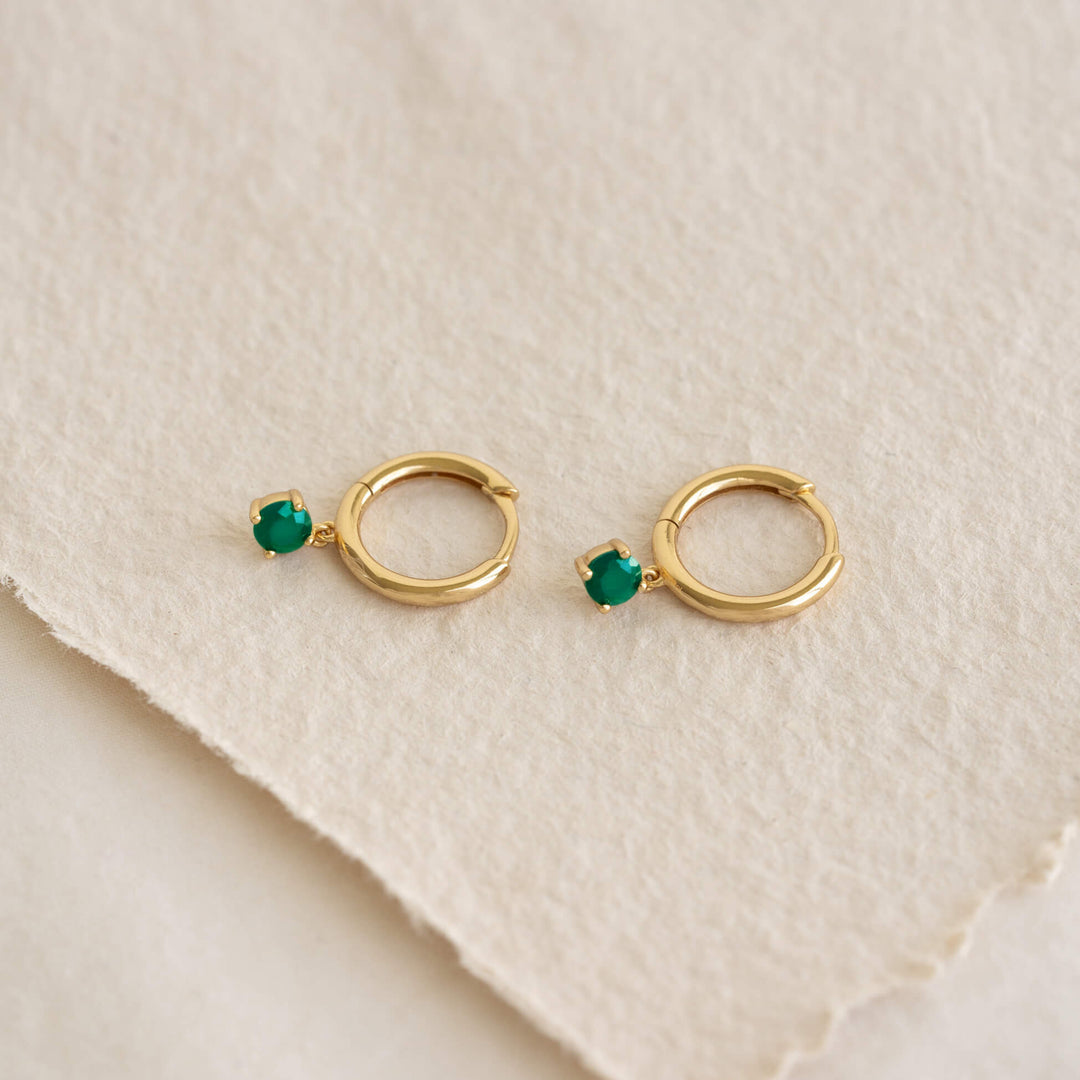 May Birthstone Drop Huggie Earrings - Green Chalcedony with gold vermeil setting on textured beige background