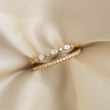 Marquise and Round Diamond Ring 14k Gold - Nova shown stacked with a delicate diamond band on silk fabric