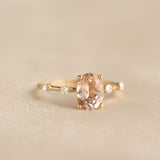 Close-up of Oval Morganite and Diamond Ring 14k Gold - Demetria featuring an oval morganite and small diamonds on gold band