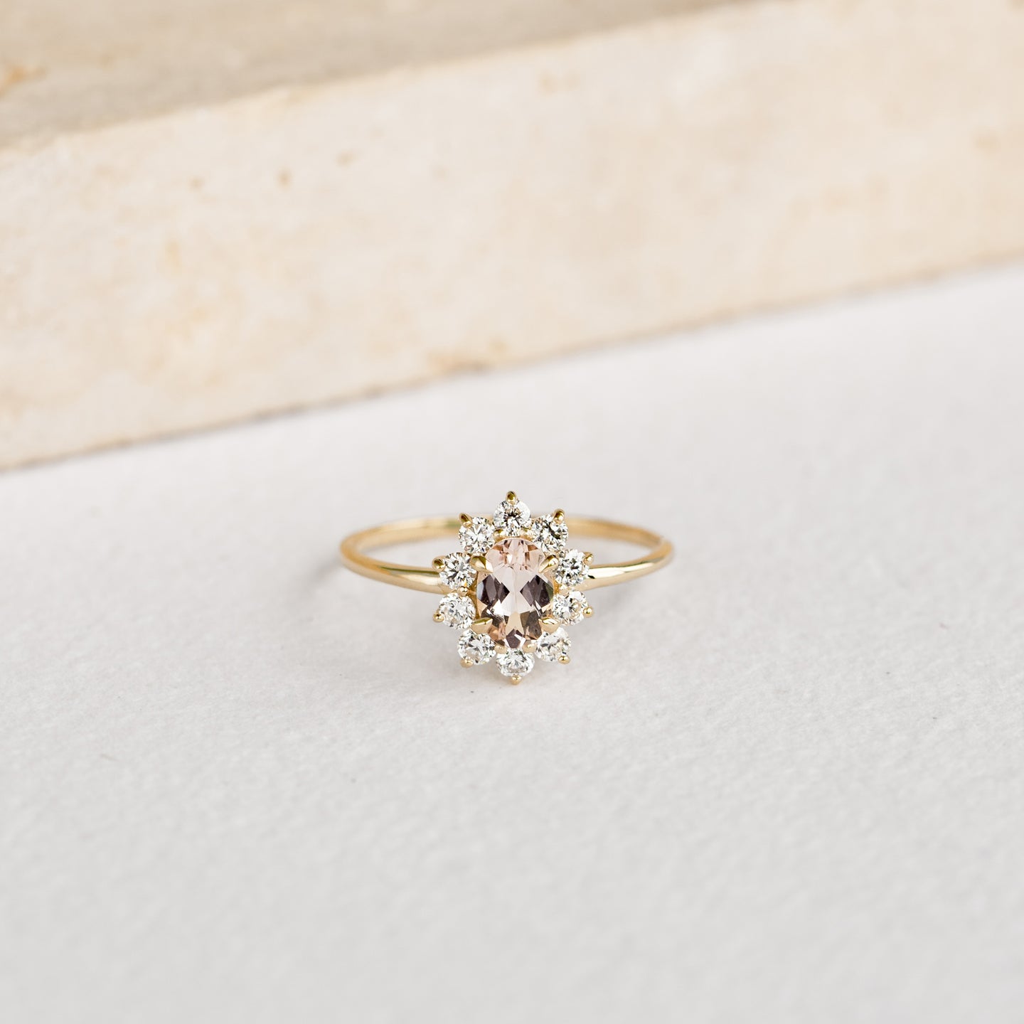 Sunburst Morganite Halo Ring - Evelina featuring an oval morganite center stone with diamond halo on a gold band
