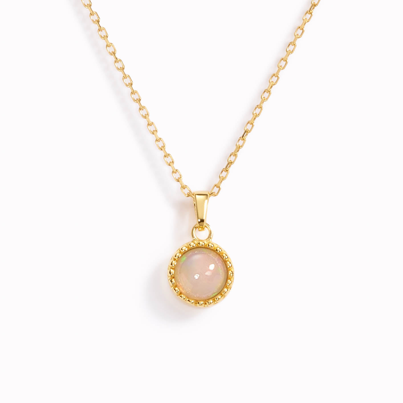 Birthstone necklace with bezel set opal pendant on a dainty gold chain