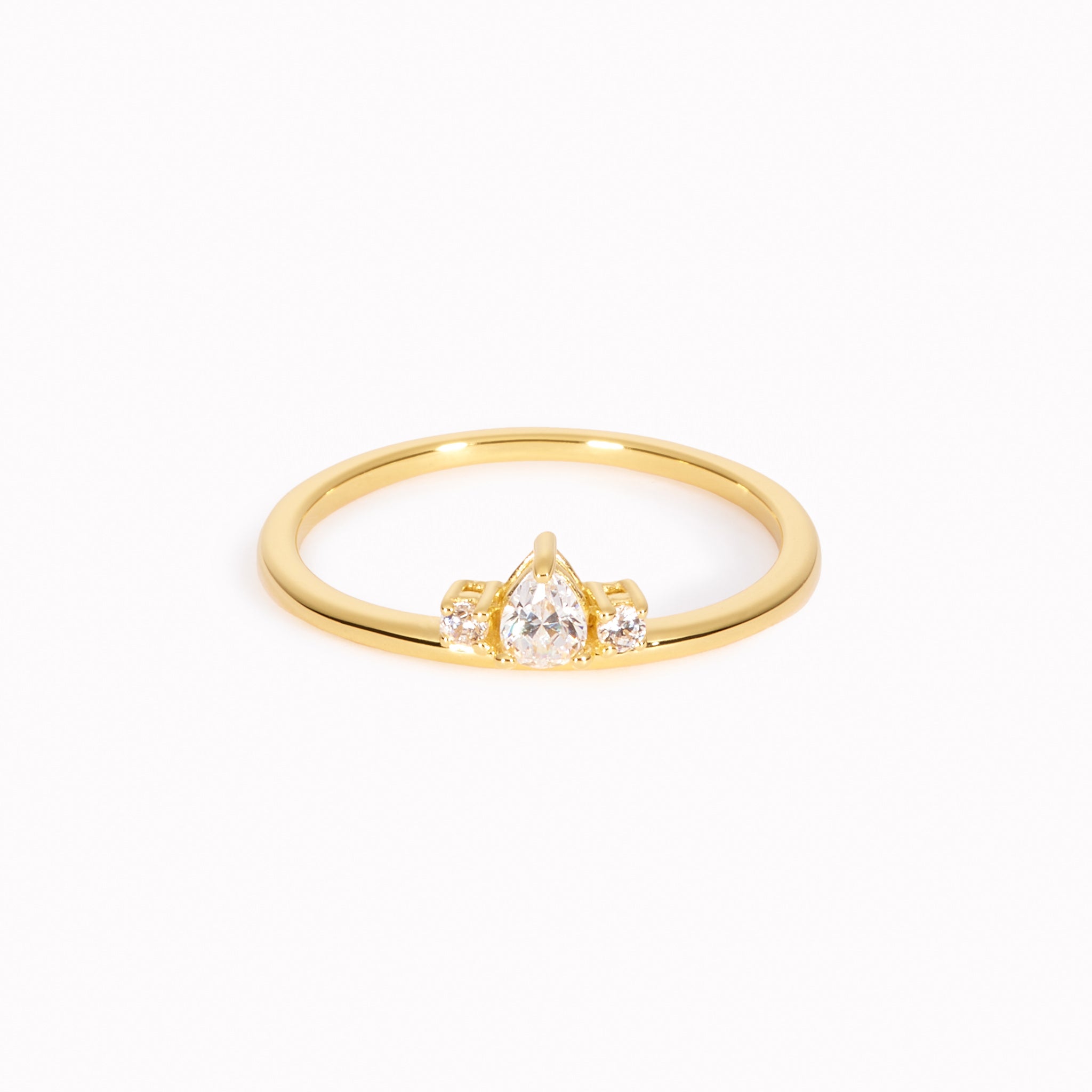 Gold ring with pear-cut and round white gemstones