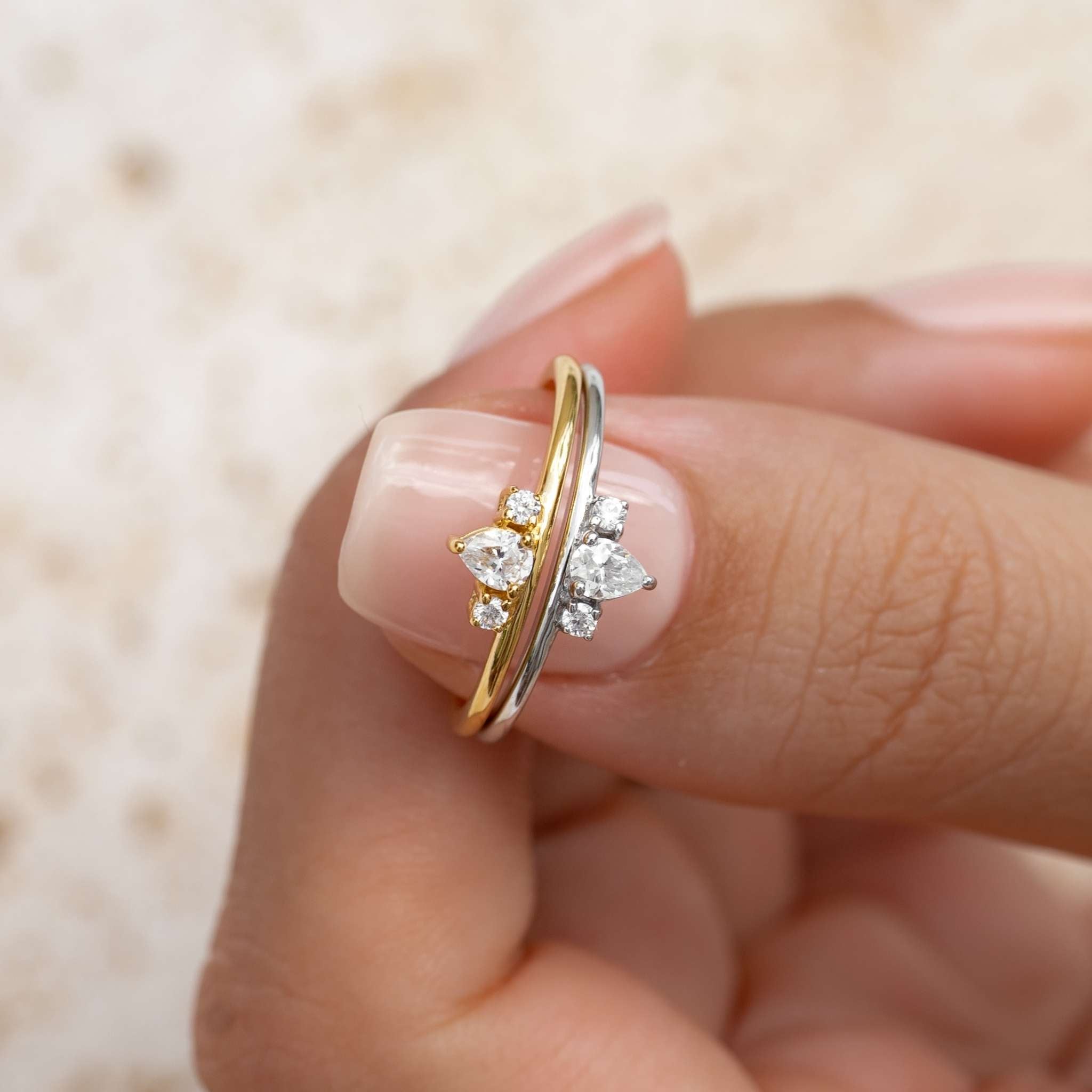 Gold and silver rings with three cubic zirconia stones 