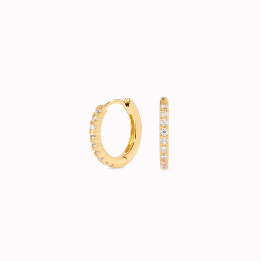 White topaz huggie hoop earrings set in gold vermeil