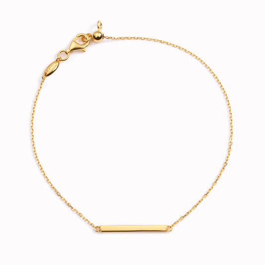 Gold chain bracelet with bar in the middle