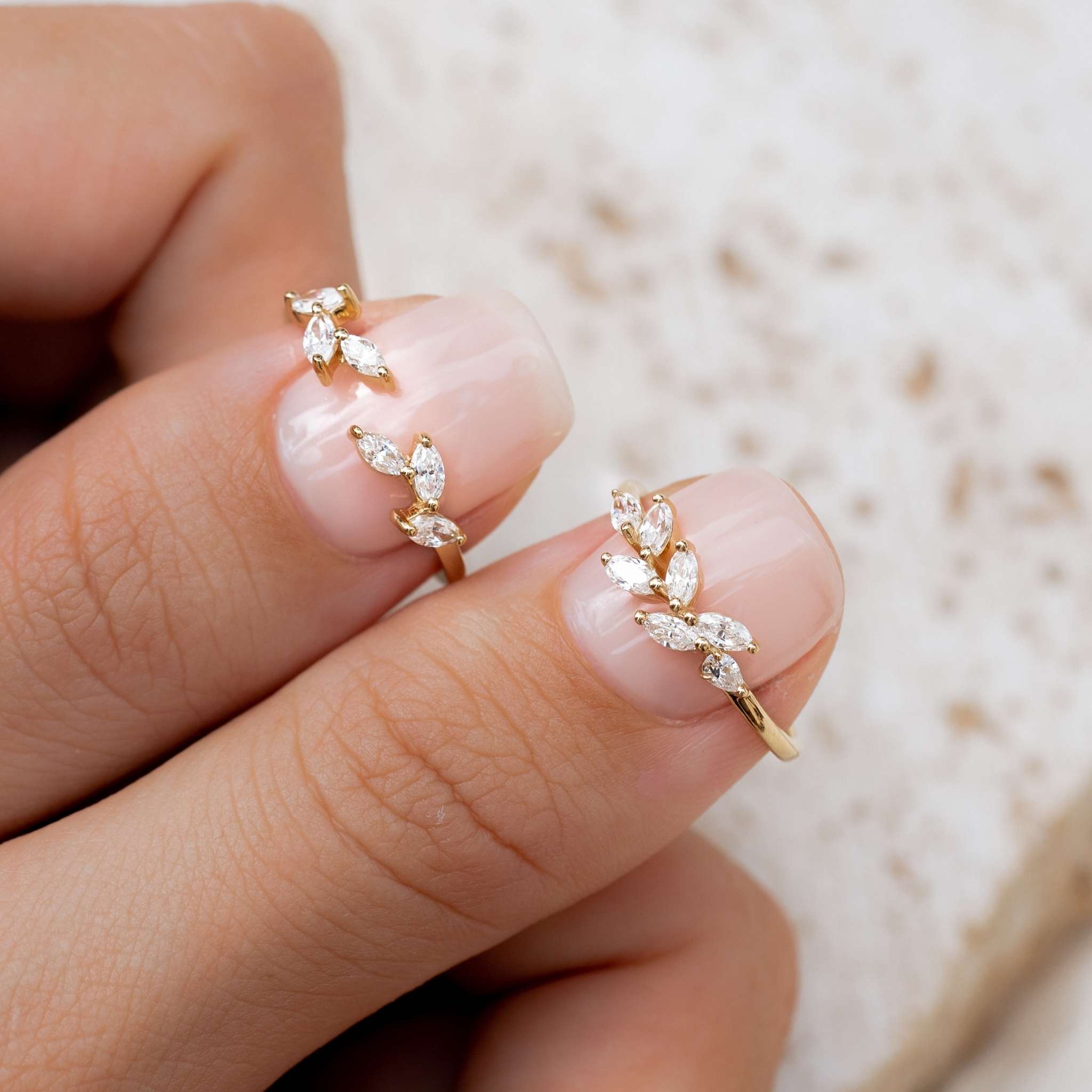 Two white gemstone leaf rings in gold vermeil
