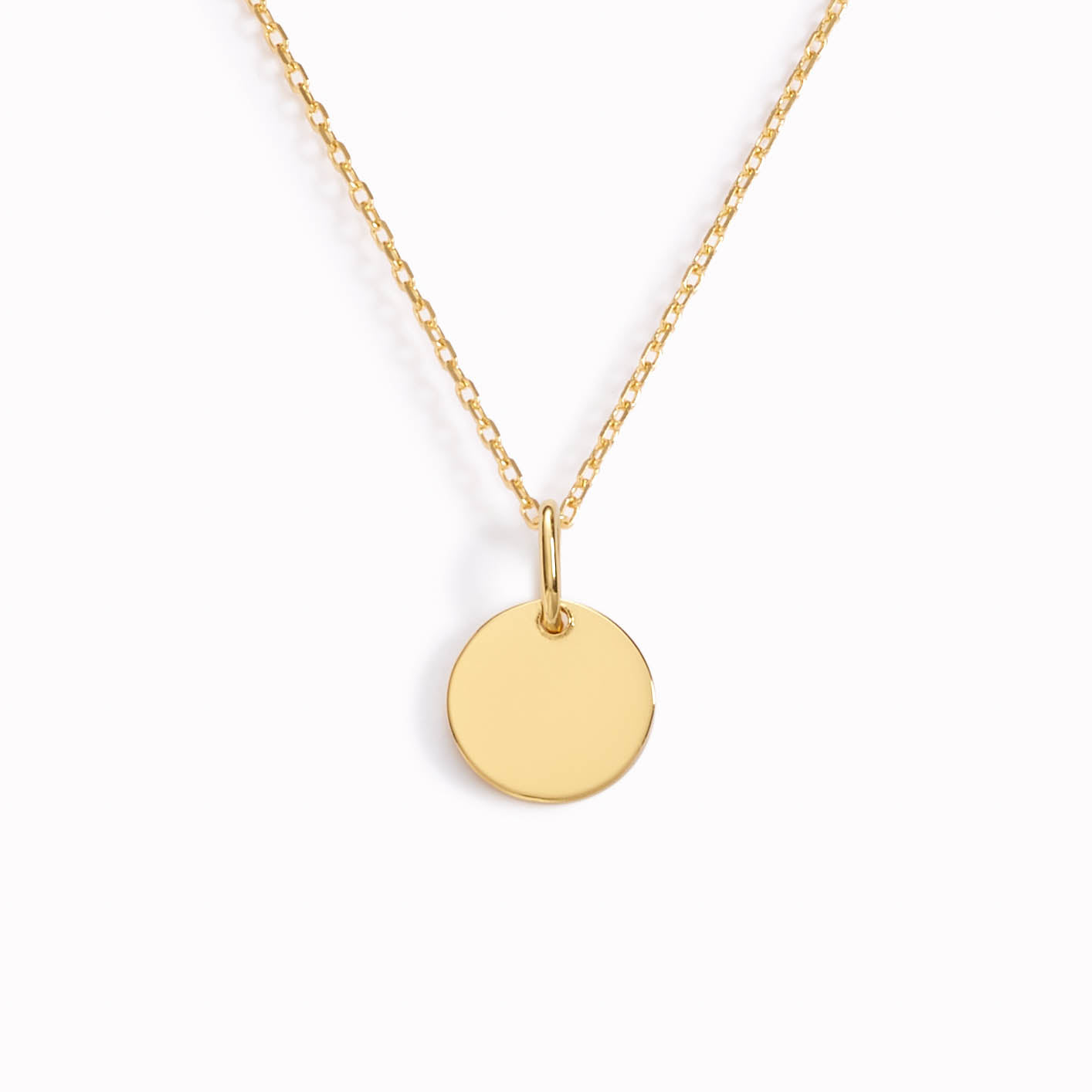 Gold necklace with disc pendant