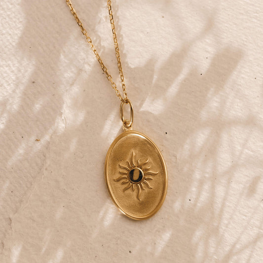 Gold sun medallion pendant necklace